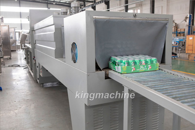 Shrink wrapping machine